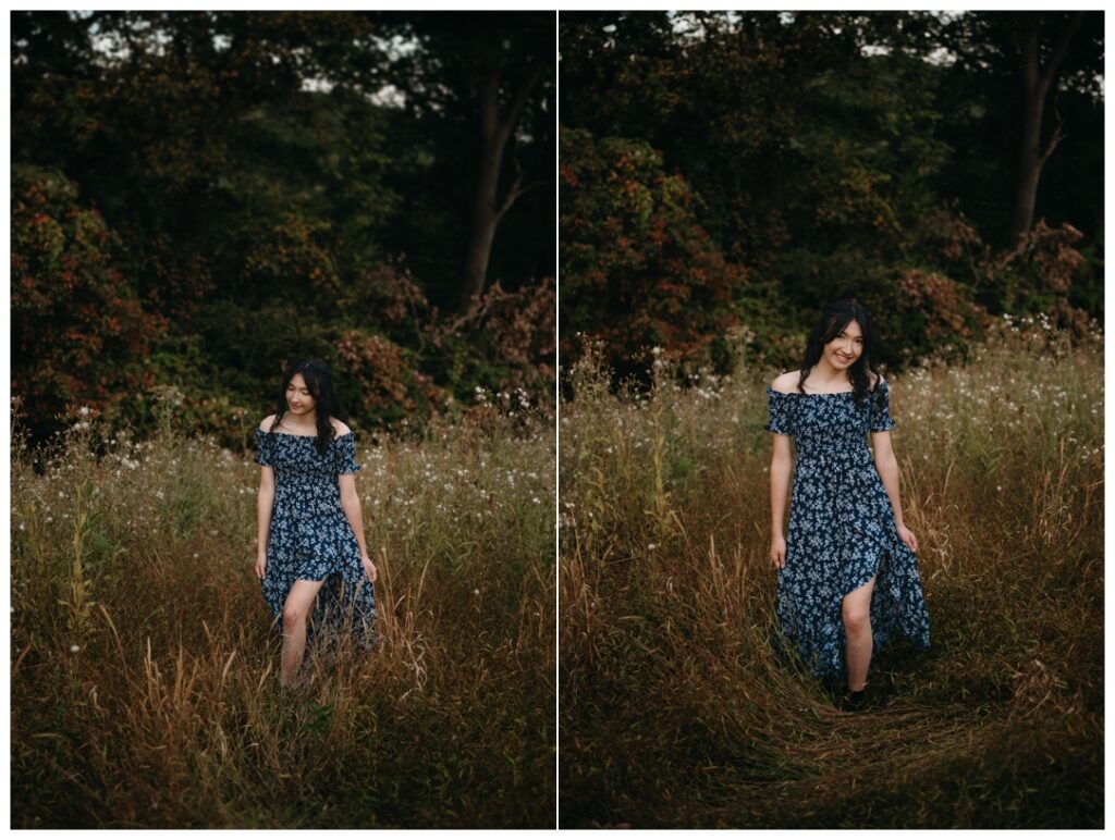 A senior girl walks through a field at hartwoood acres mansion 